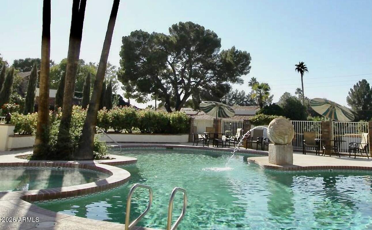 5760 North Scottsdale Road Paradise Valley, AZ 85253 - Photo 29 of 34 a view of a fountain in front of a house