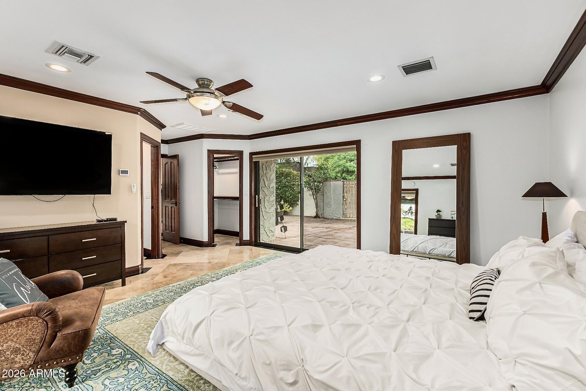 5760 North Scottsdale Road Paradise Valley, AZ 85253 - Photo 10 of 34 a large bedroom with bed tv and window