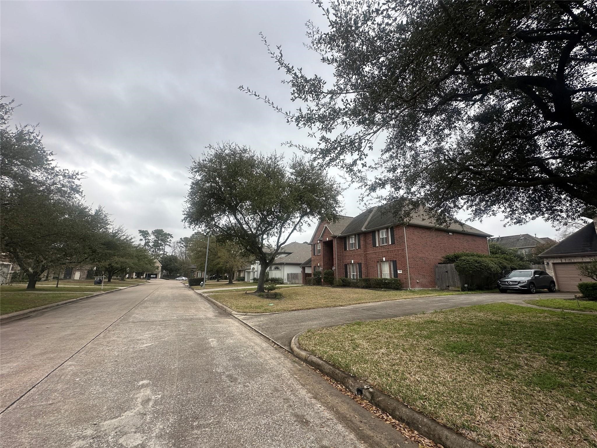 5322 Handbrook Drive Houston, TX 77069 - Photo 13 of 16 a view of a house with a yard