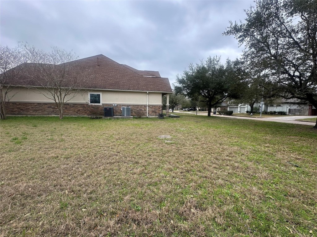 5322 Handbrook Drive Houston, TX 77069 - Photo 8 of 16 a view of a house with a yard and a large tree