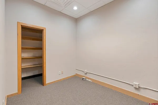 a workspace with furniture and a window