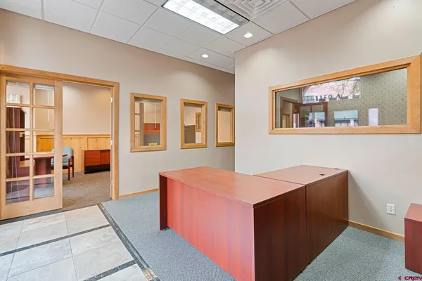 a room with furniture and large window