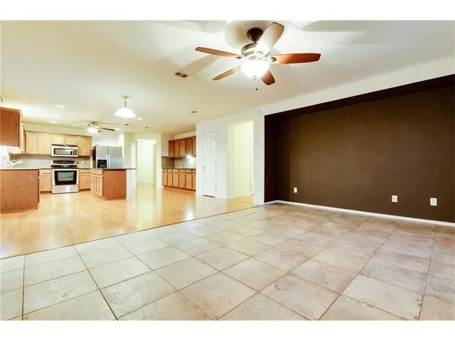 a view of kitchen and livingroom with furniture