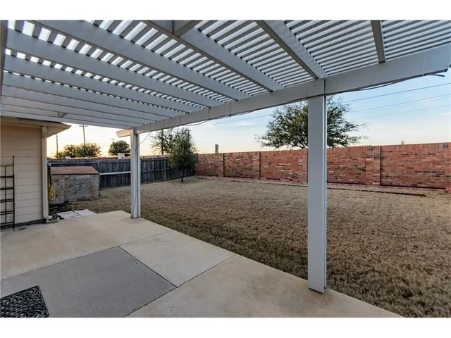 a view of backyard with porch