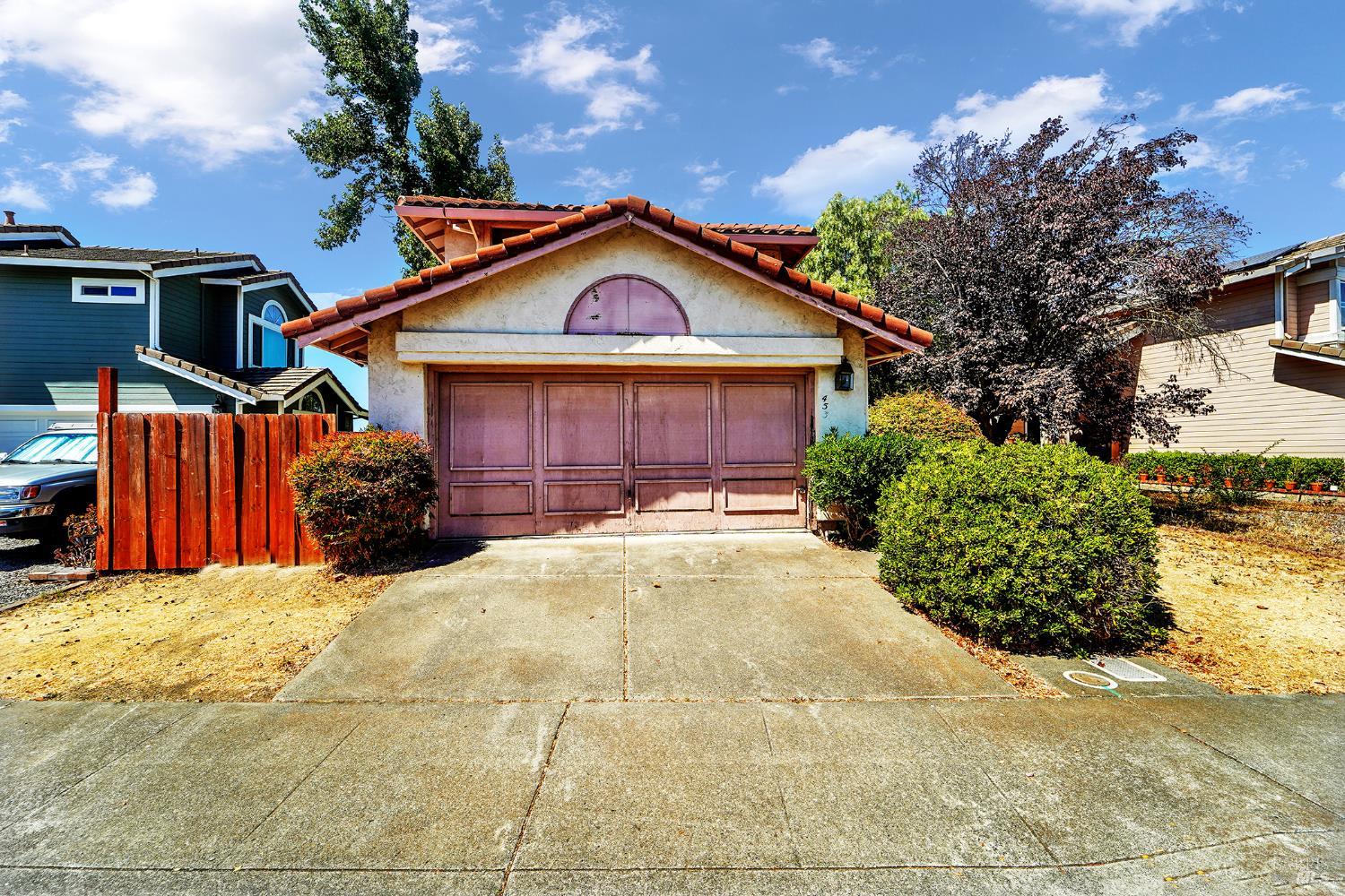 453 Knights Circle Vallejo, CA 94591 - Photo 1 of 1 a front view of a house with a yard and garage