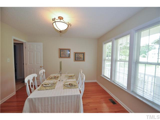 223 Ridge Drive Garner, NC 27529 - Photo 5 of 20 Beautiful formal dining room with gleaming hardwoods and a large wall of windows with tons of natural lighting. A perfect place to enjoy a special meal Dining Room