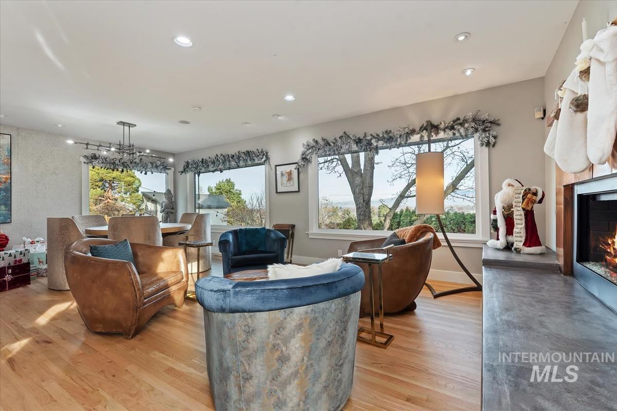 4814 Roberts Road Boise, ID 83705 - Photo 15 of 50 Living area with a lit fireplace, light wood-style floors, and recessed lighting