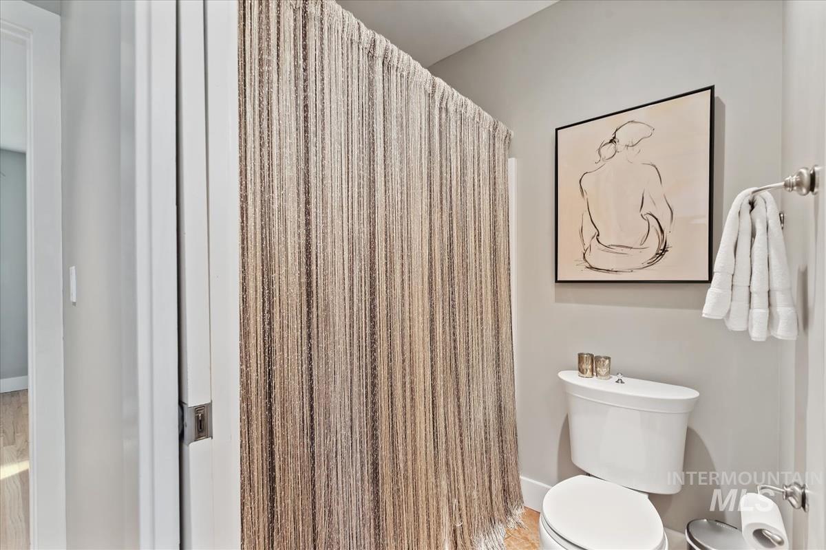 4814 Roberts Road Boise, ID 83705 - Photo 21 of 50 Bathroom with a shower with shower curtain and toilet