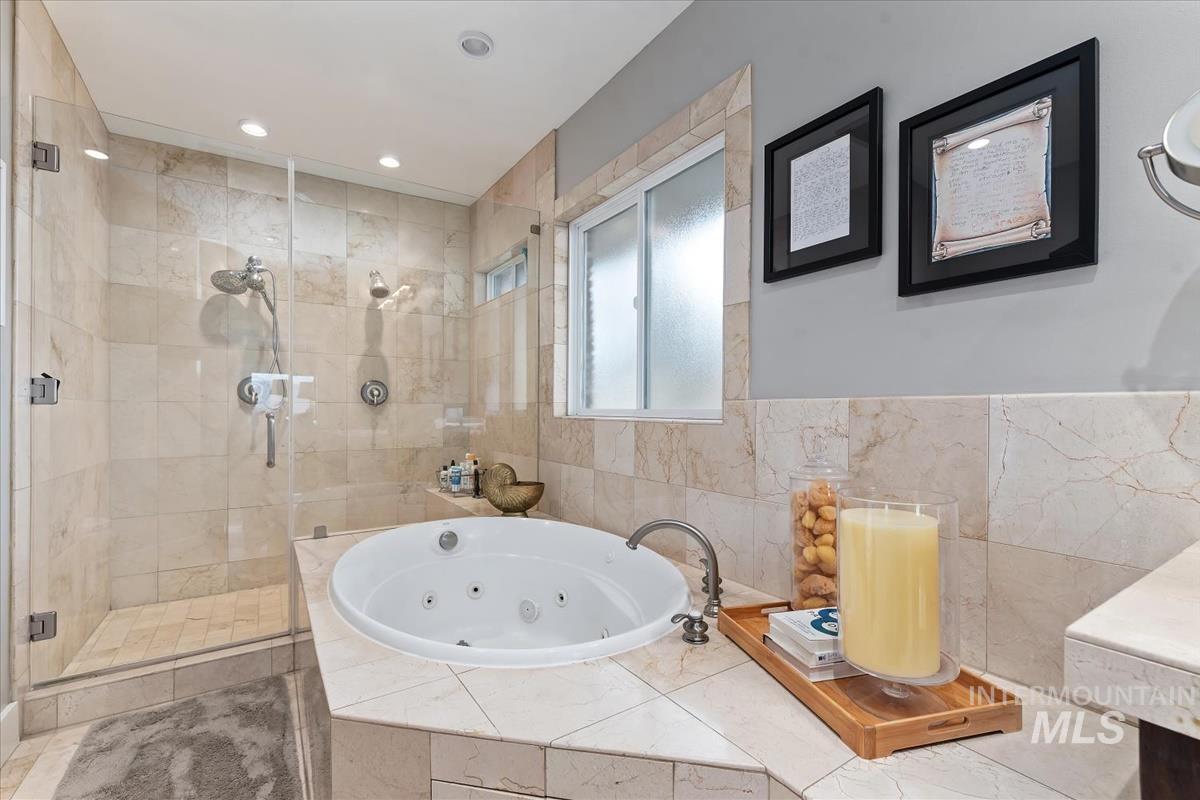 4814 Roberts Road Boise, ID 83705 - Photo 27 of 50 Bathroom featuring a shower stall, a tub with jets, vanity, and recessed lighting
