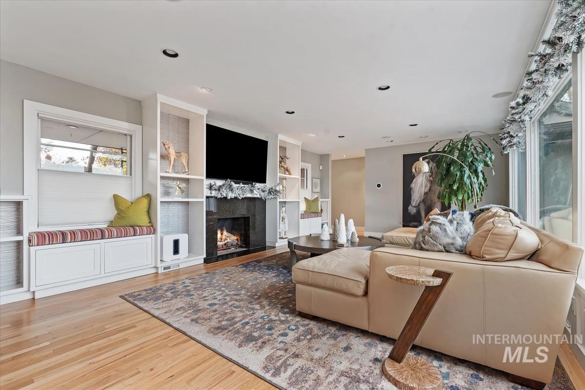 4814 Roberts Road Boise, ID 83705 - Photo 4 of 50 Living room with built in shelves, a fireplace, light wood finished floors, and recessed lighting