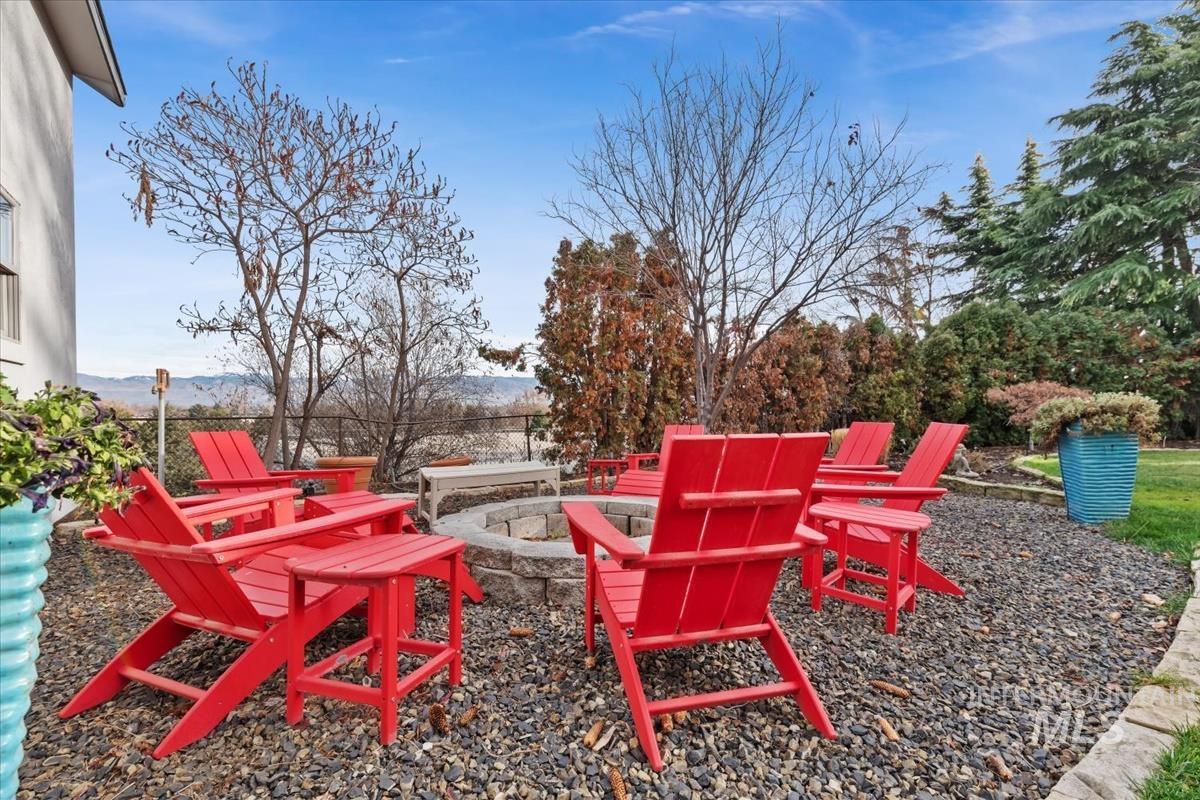 4814 Roberts Road Boise, ID 83705 - Photo 43 of 50 View of patio featuring an outdoor fire pit and a mountain view