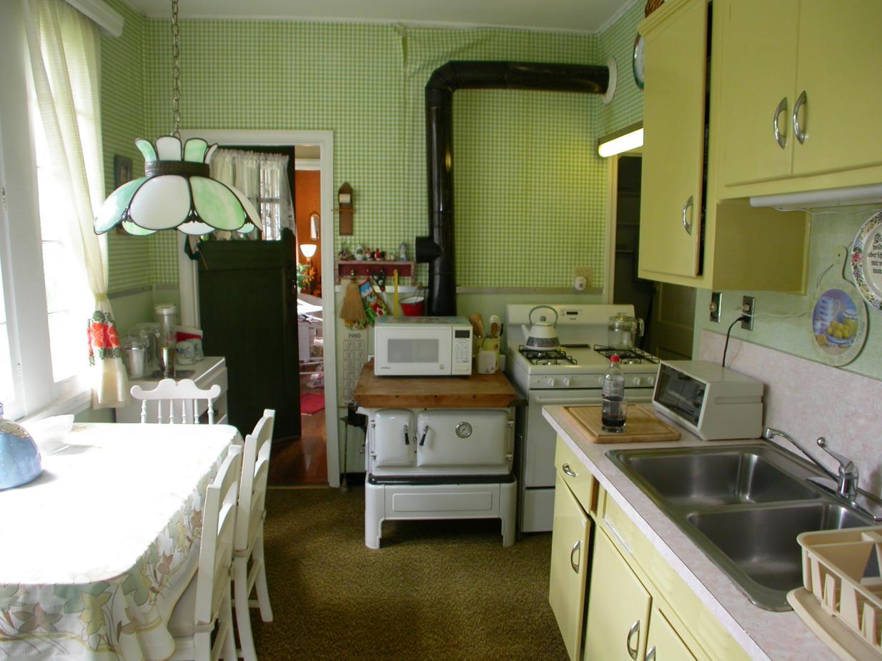 231 Sandisfield Road Sandisfield, MA 01255 - Photo 3 of 12 a kitchen with a sink stove and a refrigerator