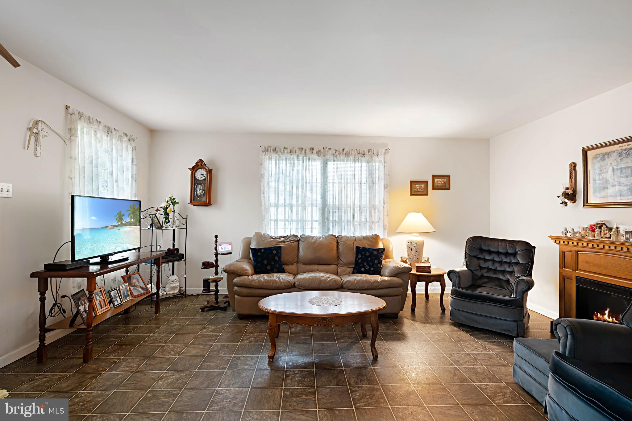 315 Beech Road Millville, NJ 08332 - Photo 8 of 21 a living room with furniture a window and a flat screen tv