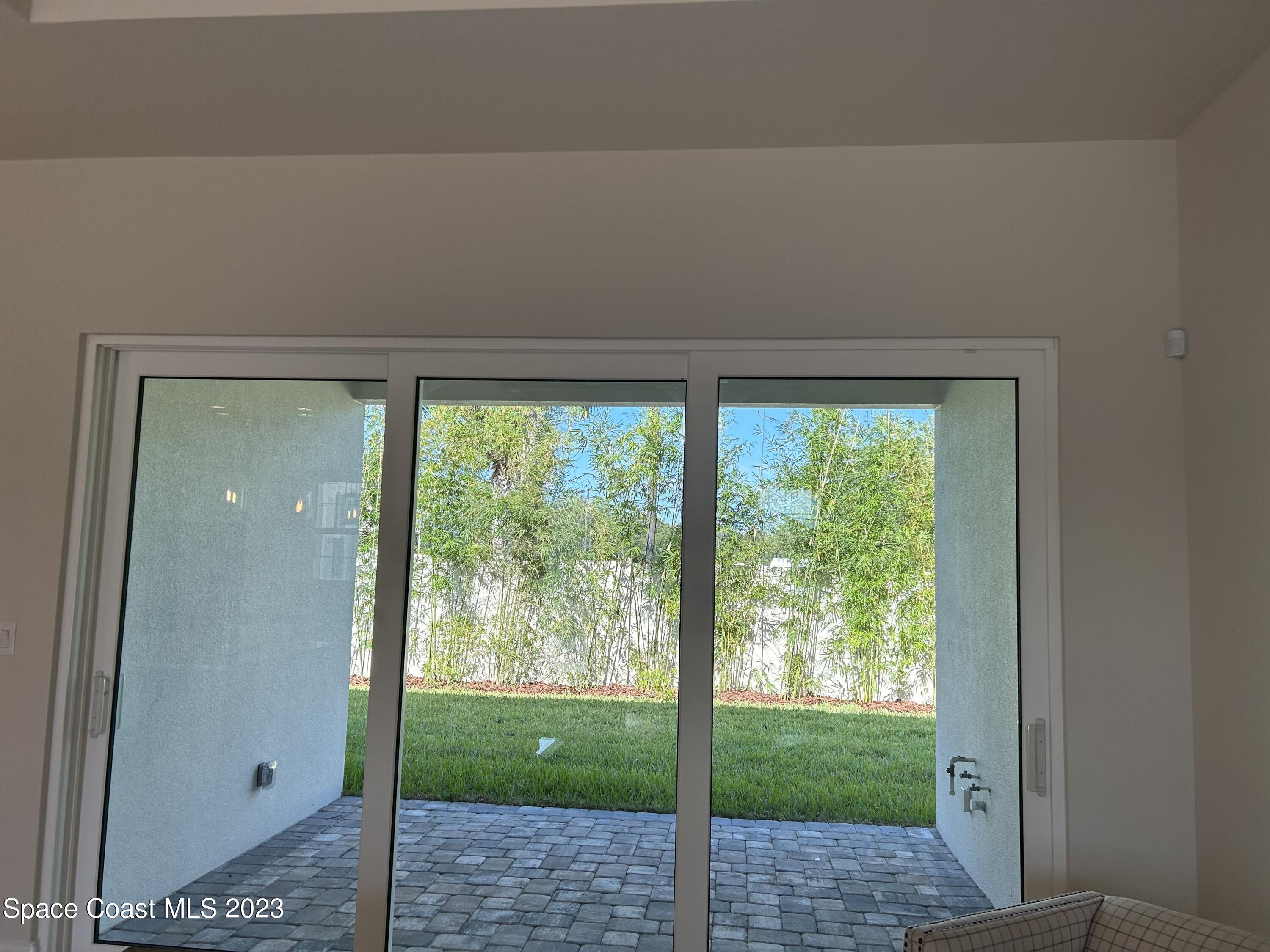 4095 Negal Circle Melbourne, FL 32901 - Photo 14 of 20 a view of backyard with green space