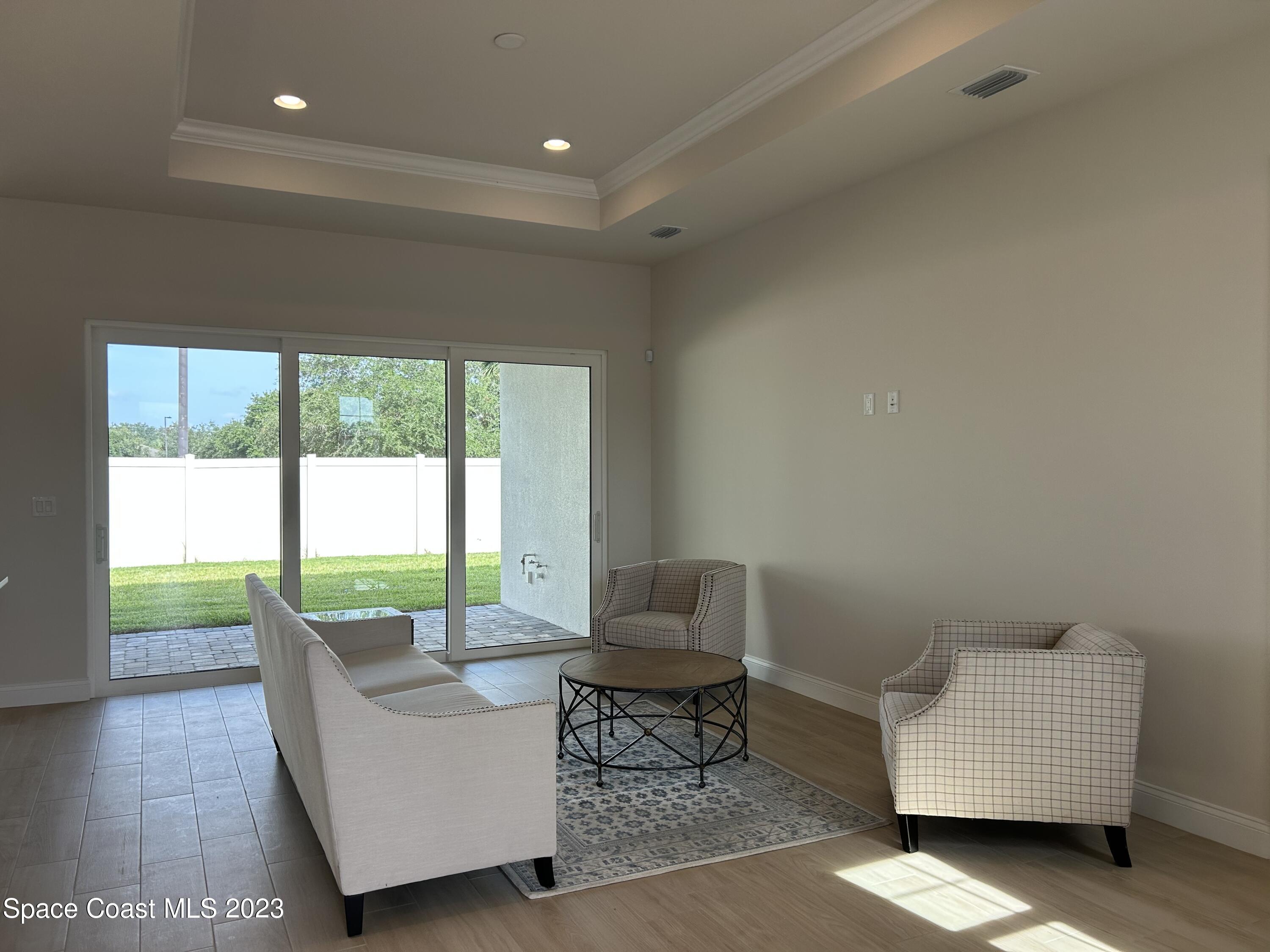4095 Negal Circle Melbourne, FL 32901 - Photo 10 of 20 a living room with furniture and a large window