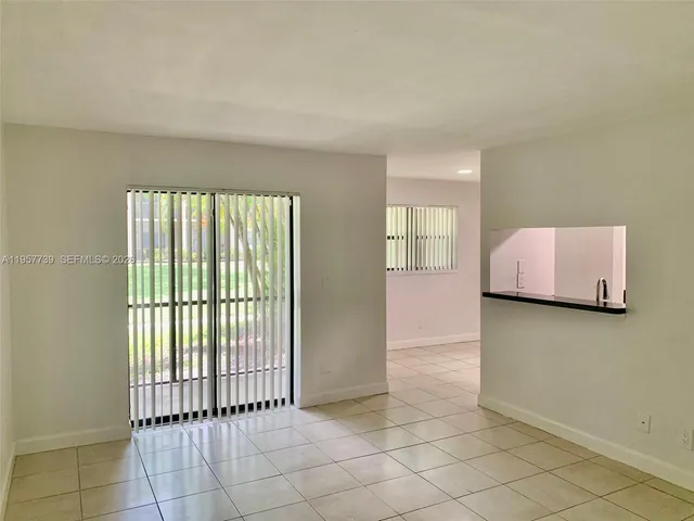 a view of an empty room and window