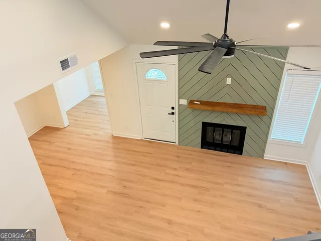 a bedroom with a bed and a fireplace