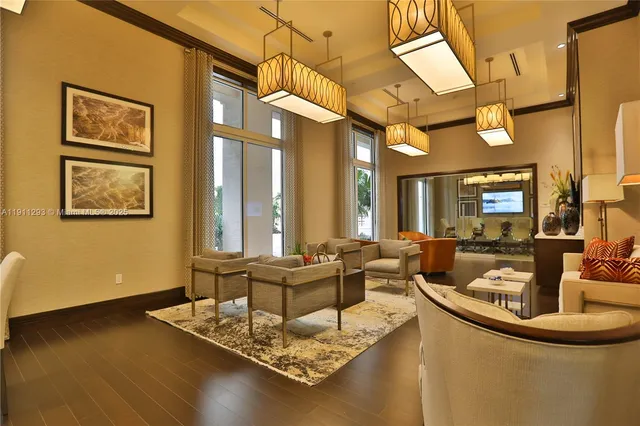 a living room with fireplace furniture and a large window