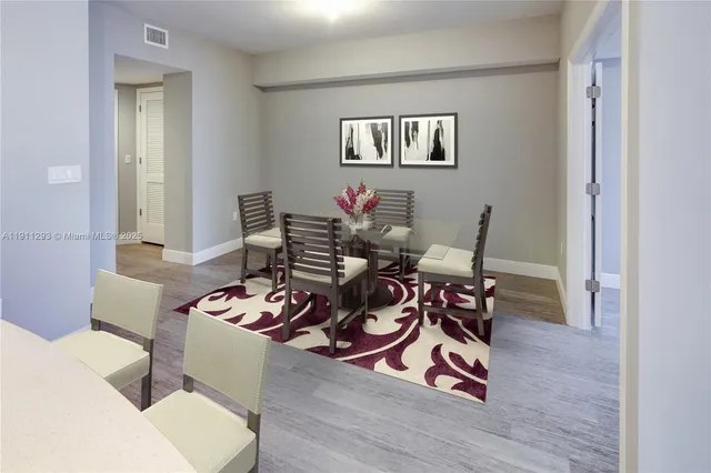 a living room with furniture a window and a table