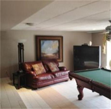 96 Narrows Road Freetown, MA 02702 - Photo 17 of 26 a living room with furniture and a flat screen tv