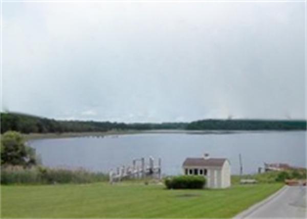 96 Narrows Road Freetown, MA 02702 - Photo 19 of 26 a view of a lake with houses in the back