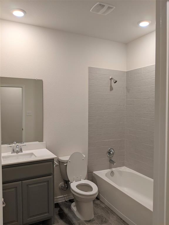 3024 Meredith Lane Forney, TX 75126 - Photo 8 of 22 a bathroom with a sink a toilet and shower