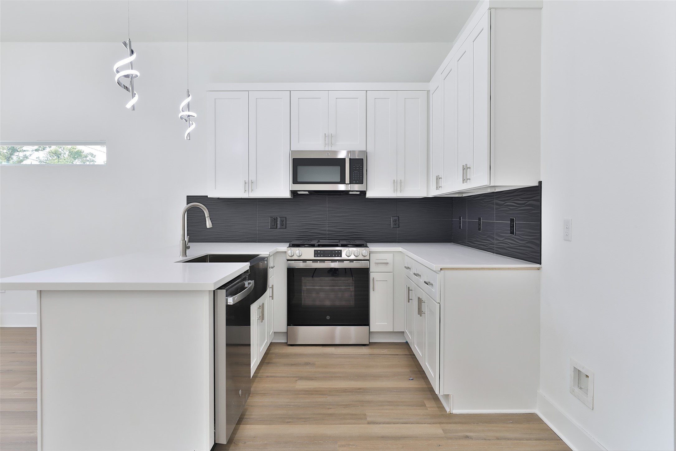 8109 Cabot Street, Unit A/B Houston, TX 77078 - Photo 12 of 33 a kitchen with stainless steel appliances granite countertop a stove and a refrigerator