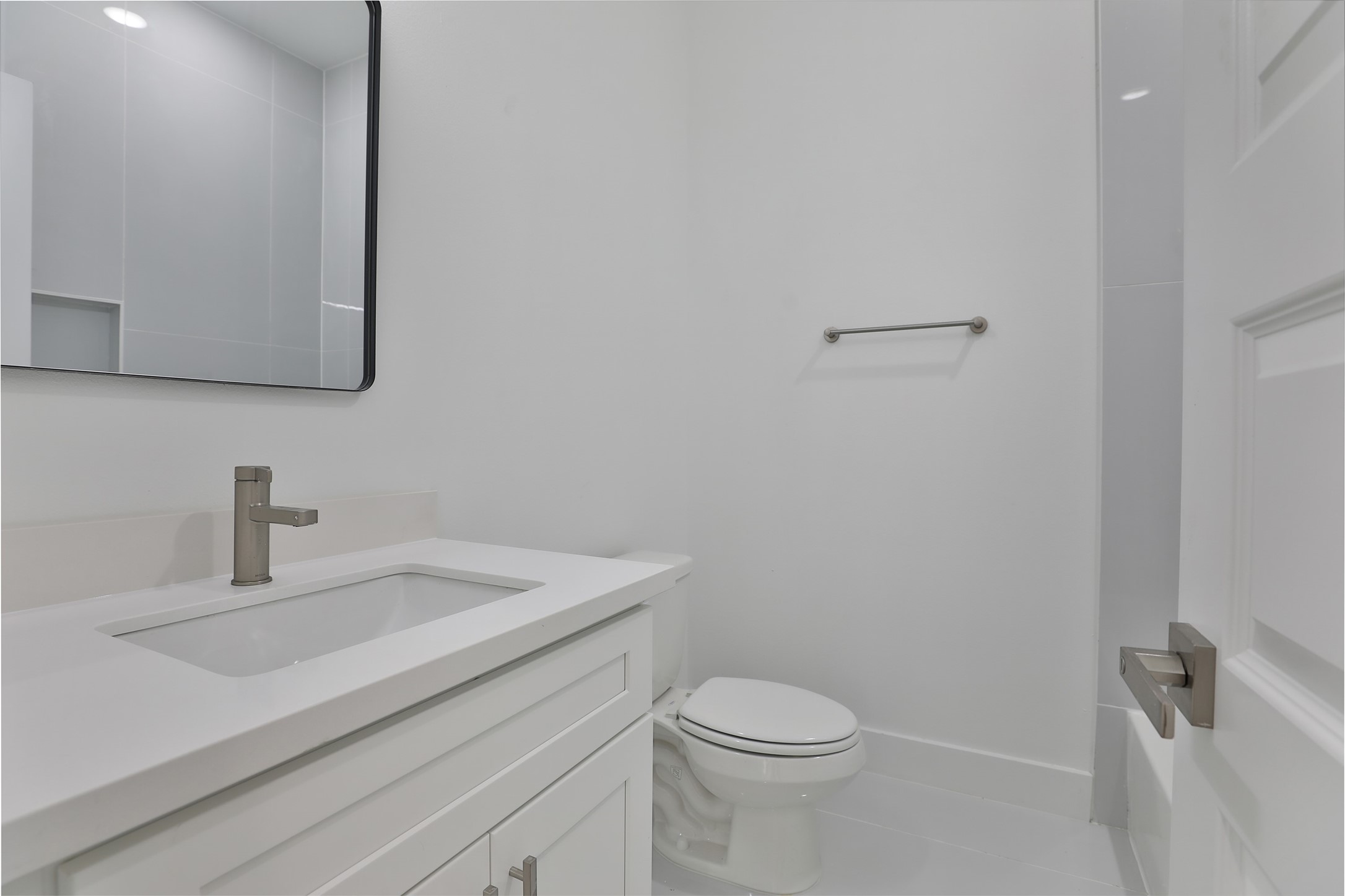 8109 Cabot Street, Unit A/B Houston, TX 77078 - Photo 16 of 33 a bathroom with a sink a toilet and mirror