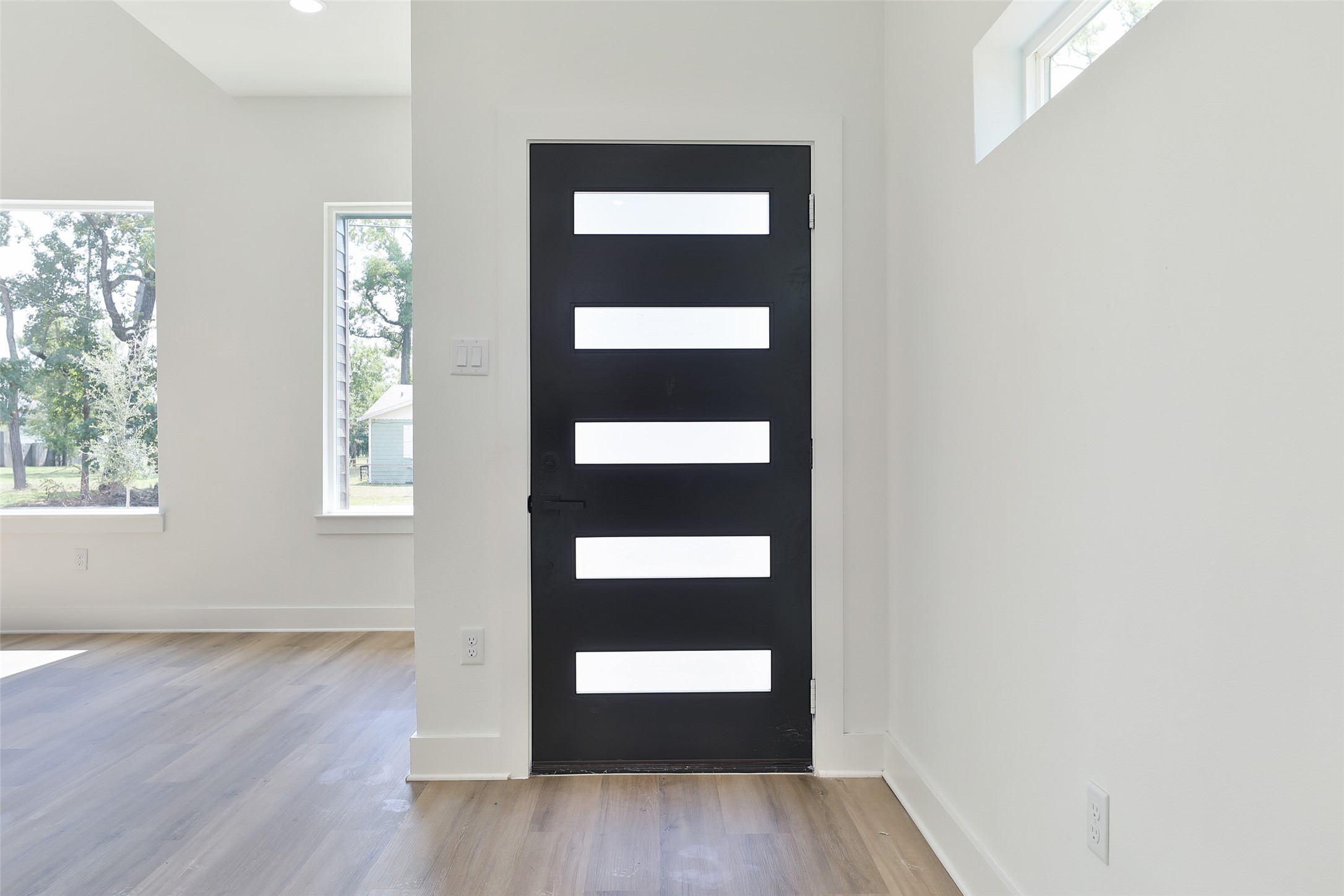 8109 Cabot Street, Unit A/B Houston, TX 77078 - Photo 7 of 33 an empty room with wooden floor and windows