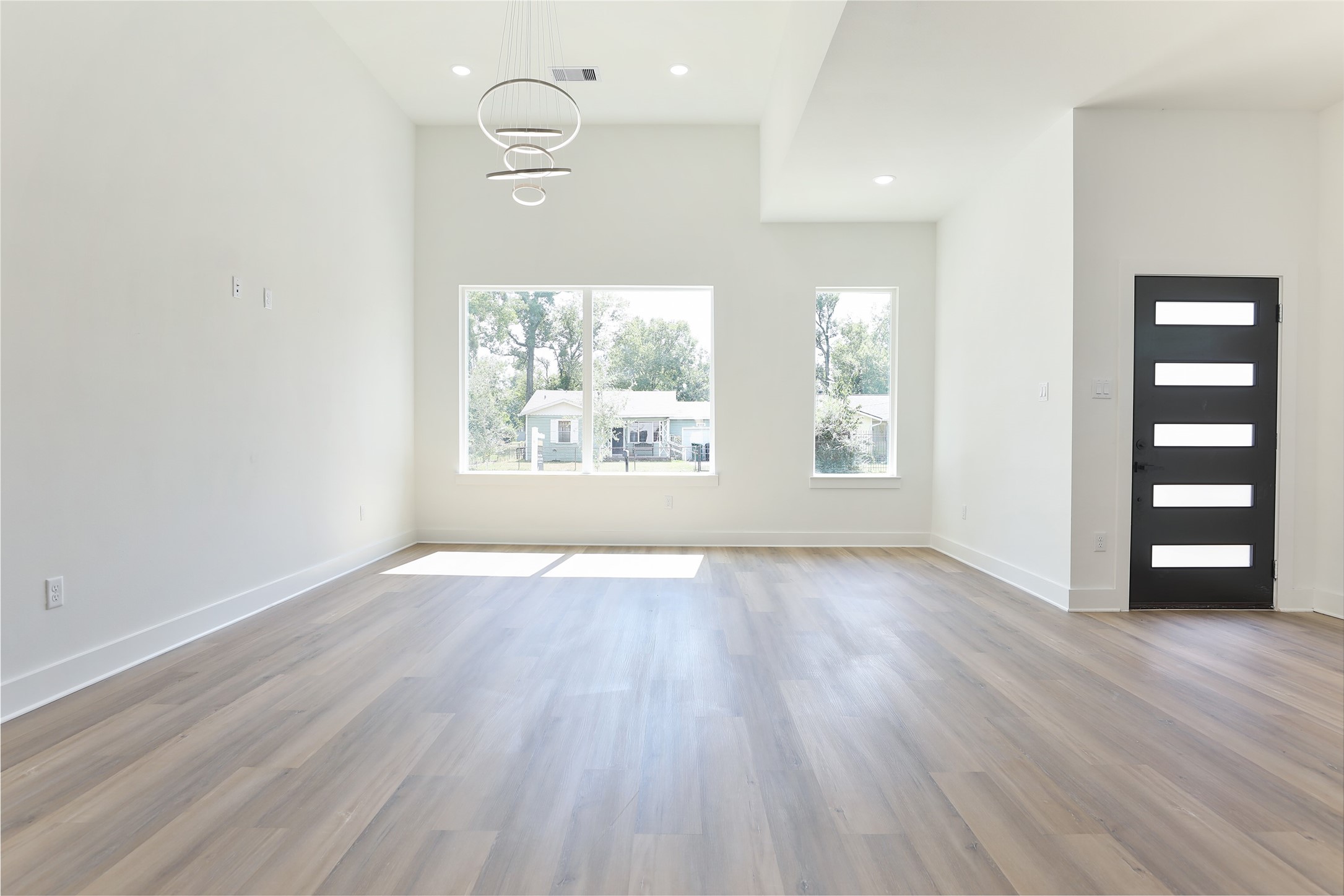 8109 Cabot Street, Unit A/B Houston, TX 77078 - Photo 8 of 33 an empty room with wooden floor closet and windows