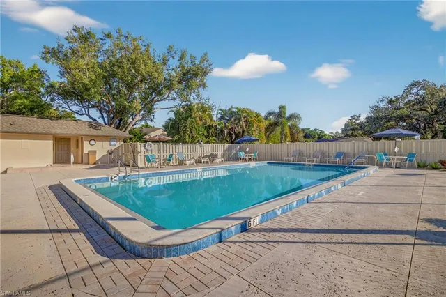 a view of house with outdoor space and sitting area