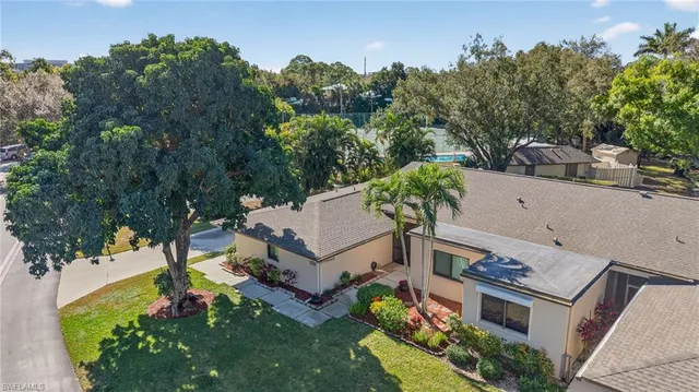 an aerial view of a house with outdoor space