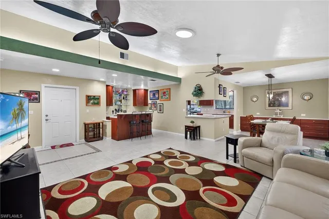 a living room with furniture and a rug