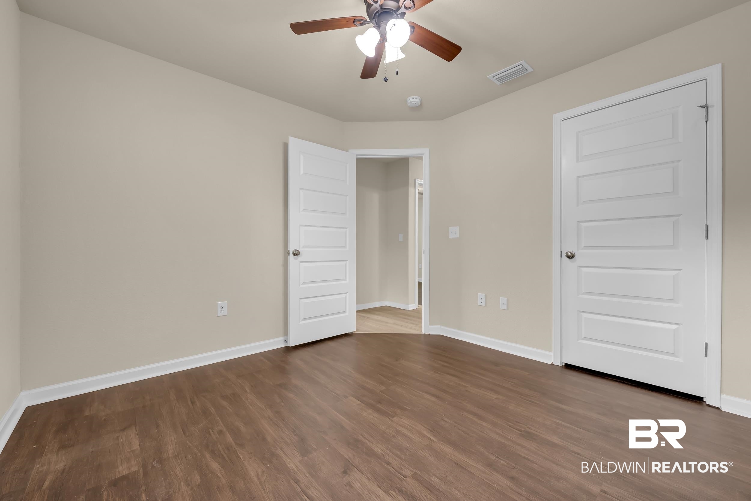 1704 Abbey Loop Foley, AL 36535 - Photo 27 of 38 Interior room featuring wood-finish flooring and neutral wall tones
