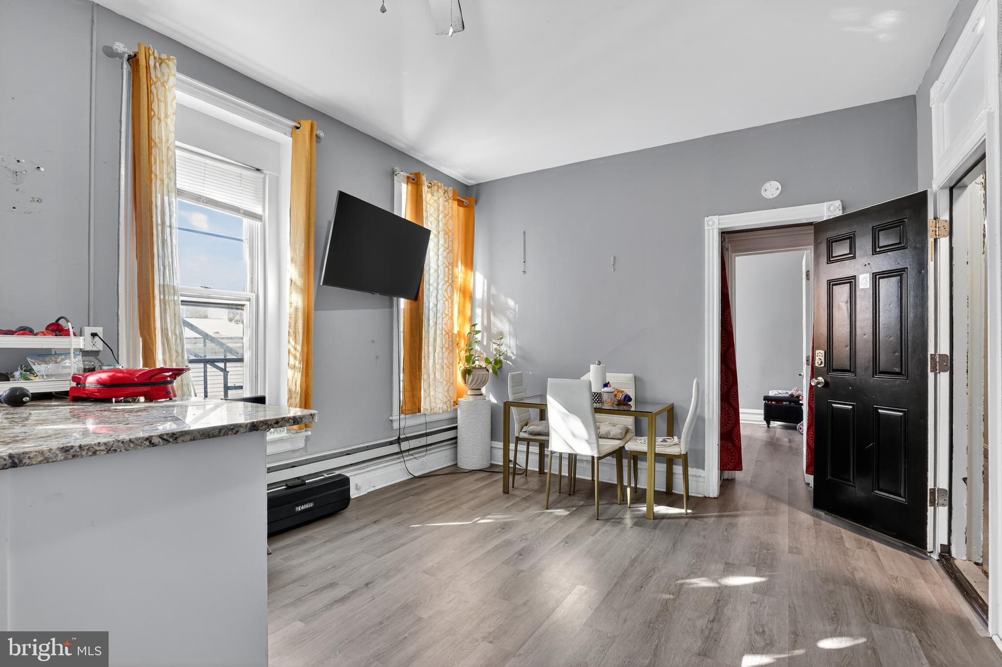 1259 North 10th Street Reading, PA 19604 - Photo 19 of 36 a living room with furniture and large window