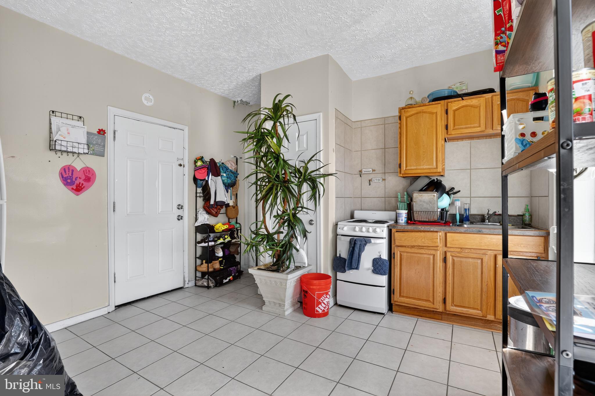 1259 North 10th Street Reading, PA 19604 - Photo 24 of 36 a kitchen with a refrigerator and a stove
