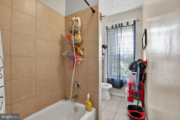 a view of a room with wooden floor and window