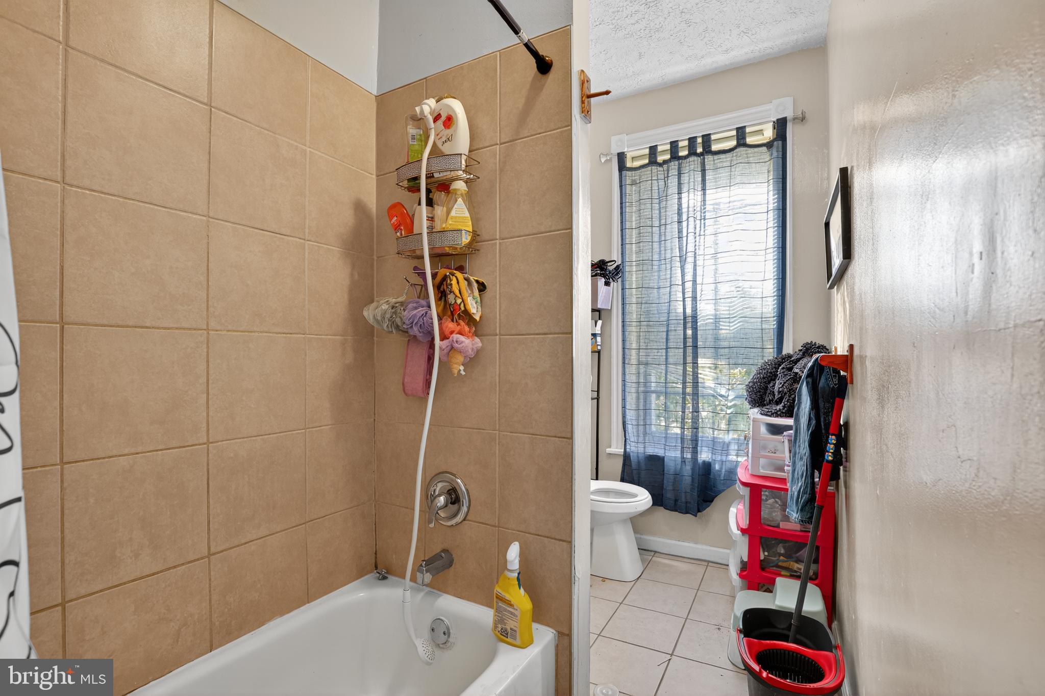 1259 North 10th Street Reading, PA 19604 - Photo 27 of 36 a bathroom with a shower and a toilet