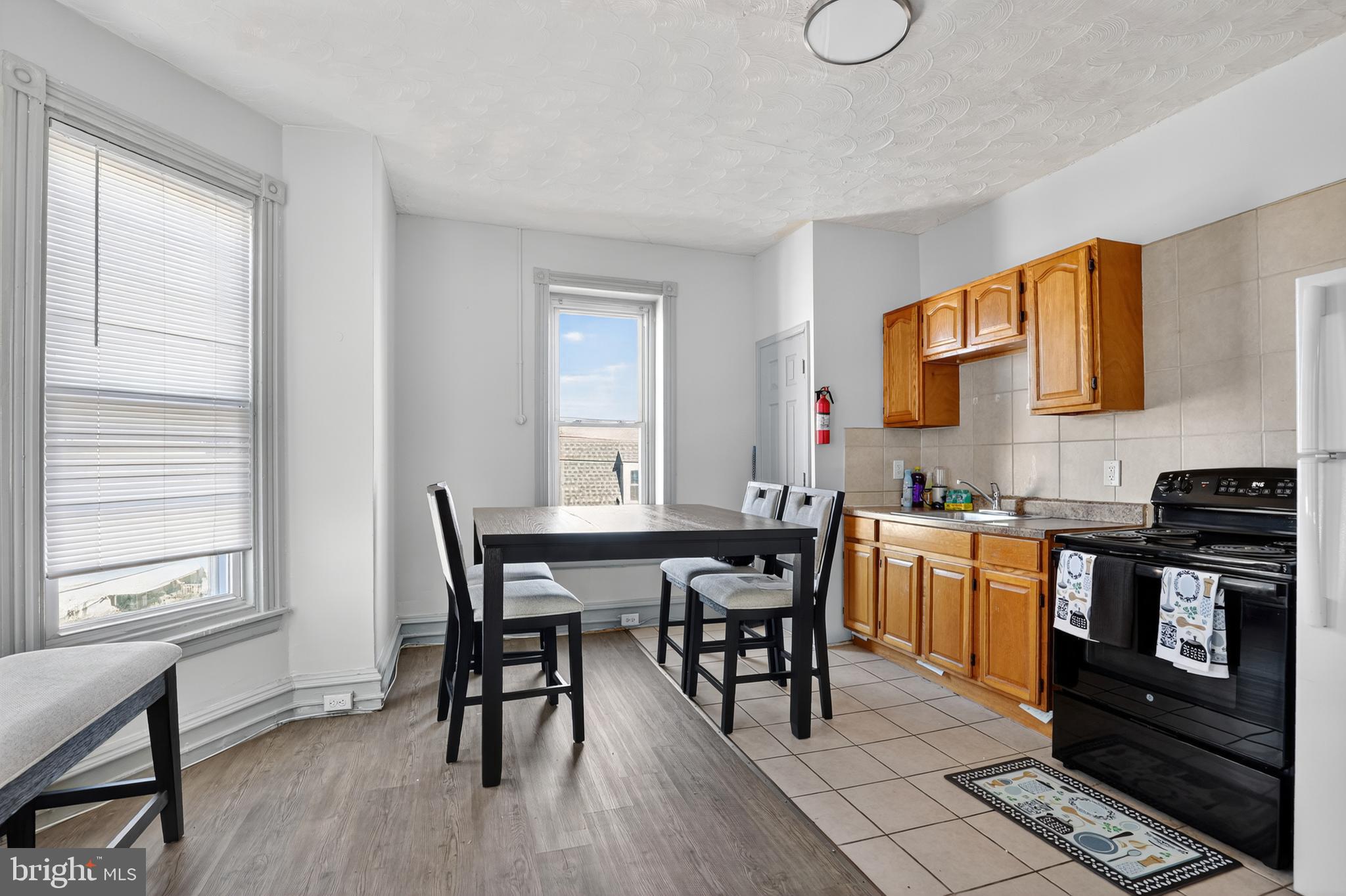 1259 North 10th Street Reading, PA 19604 - Photo 32 of 36 a view of a dining room with furniture and wooden floor