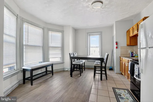 a bedroom with bed and a window