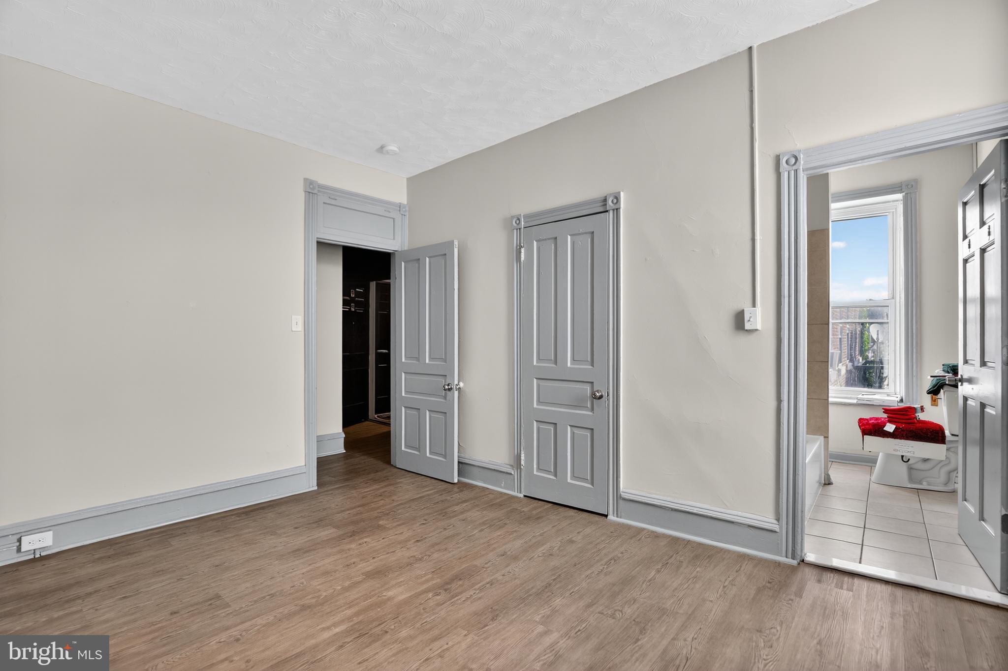 1259 North 10th Street Reading, PA 19604 - Photo 34 of 36 a view of an empty room and wooden floor and closet