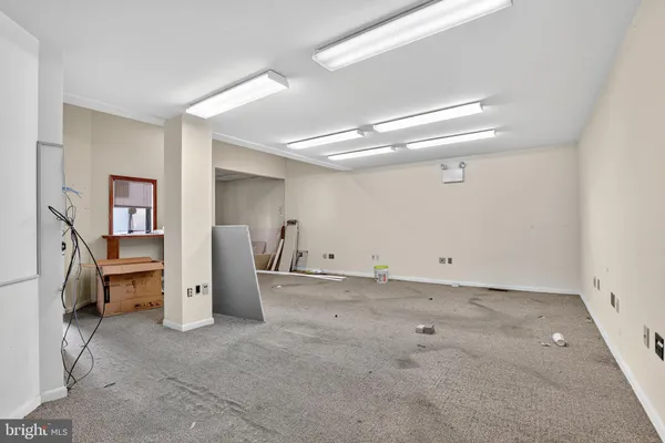a view of a room with refrigerator and furniture