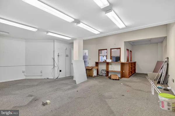 a view of a livingroom with furniture and toys