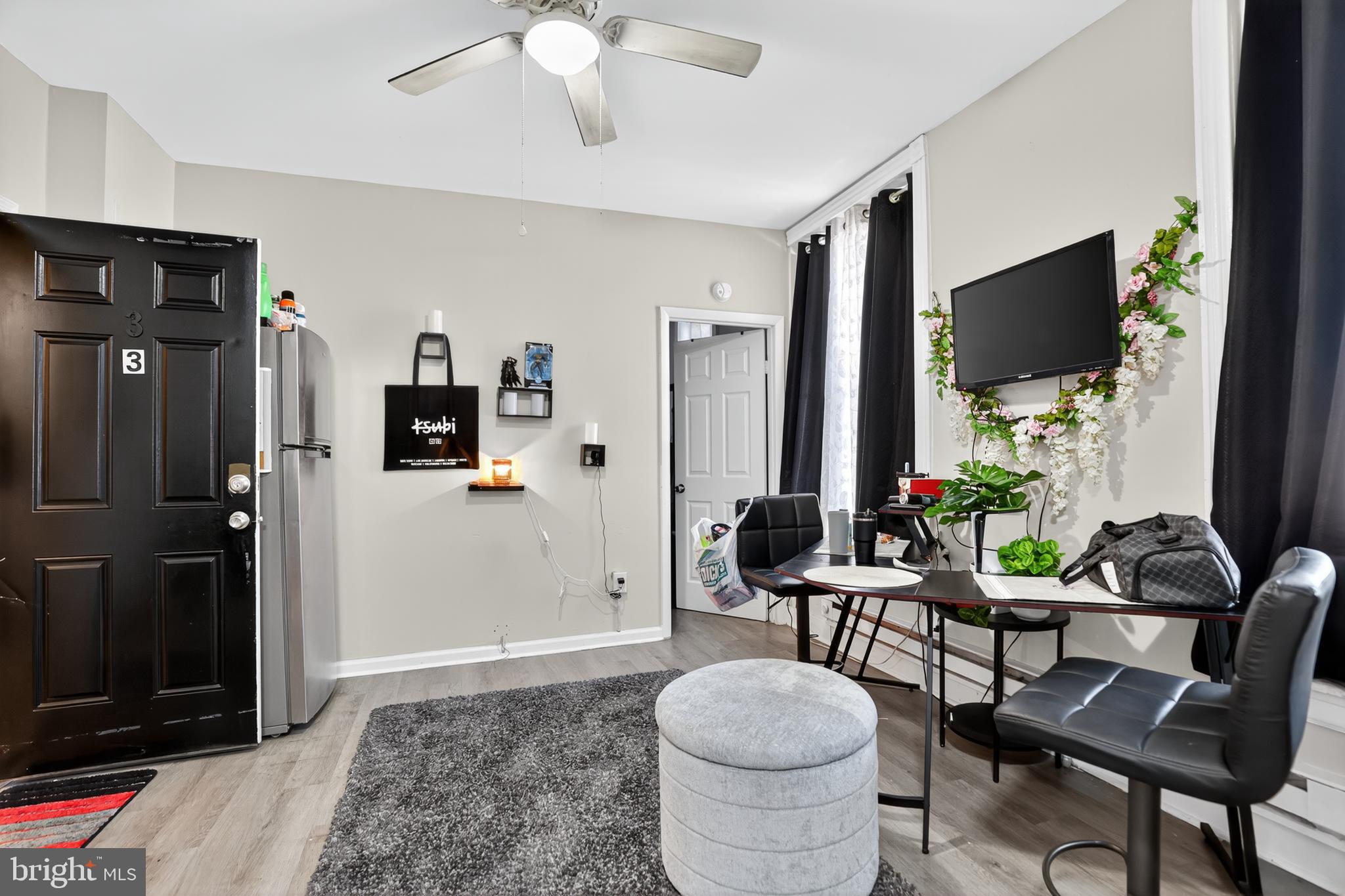 1259 North 10th Street Reading, PA 19604 - Photo 9 of 36 a living room with furniture and a flat screen tv