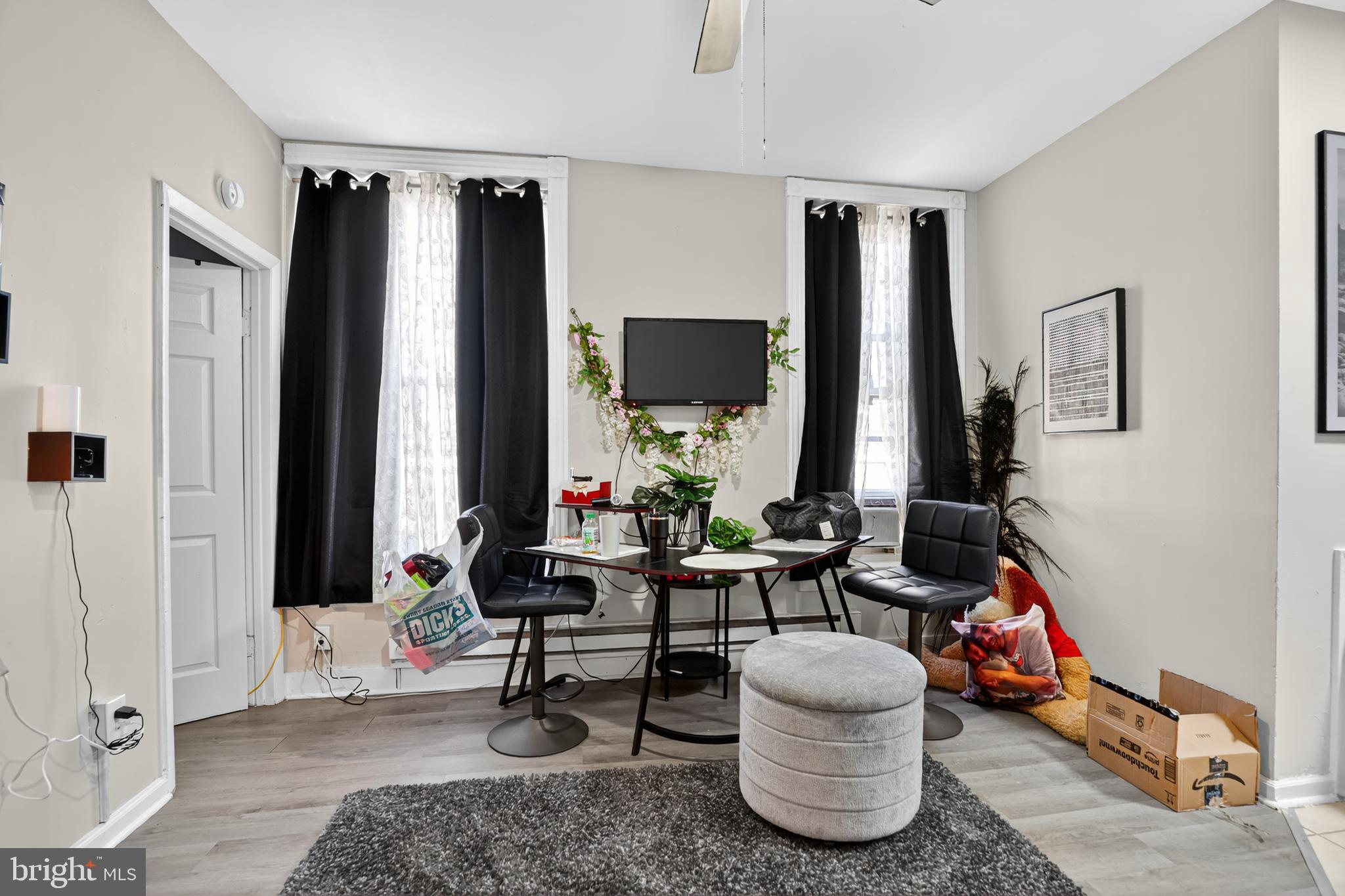 1259 North 10th Street Reading, PA 19604 - Photo 10 of 36 a living room with furniture and large windows