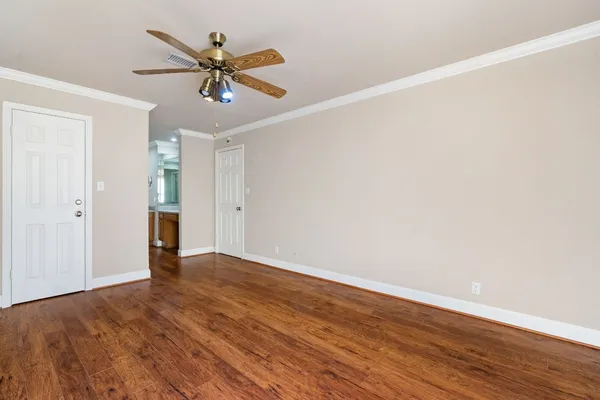 a hall with a sink and cabinets