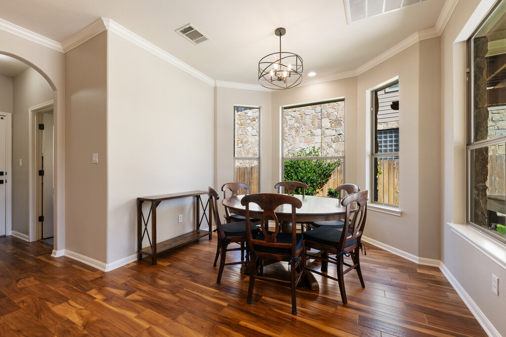 12801 Little Dipper Path Austin, TX 78732 - Photo 14 of 29 a view of a dining room with furniture window and wooden floor