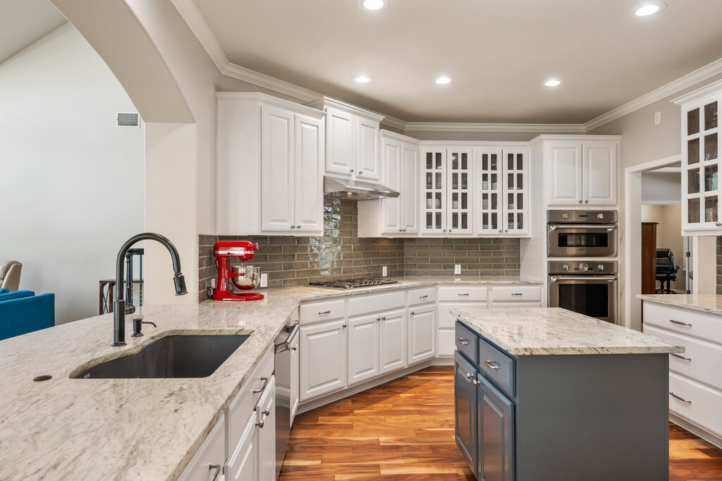 12801 Little Dipper Path Austin, TX 78732 - Photo 16 of 29 a kitchen with a sink stove top oven and refrigerator