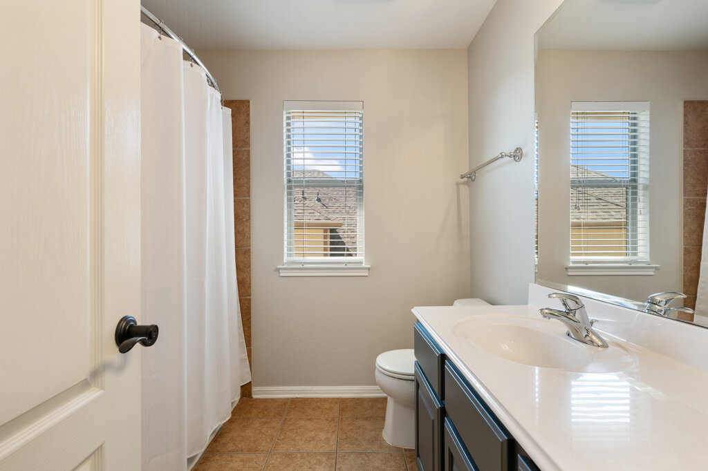 12801 Little Dipper Path Austin, TX 78732 - Photo 23 of 29 a bathroom with a sink toilet and shower