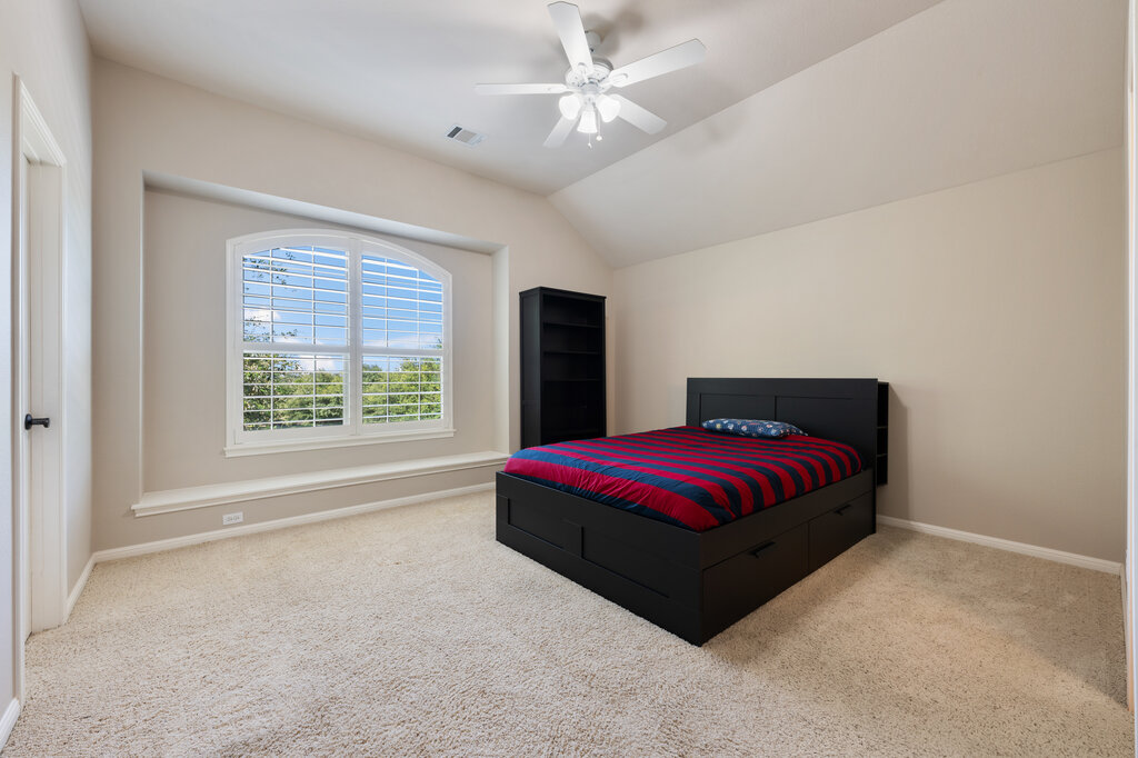 12801 Little Dipper Path Austin, TX 78732 - Photo 24 of 29 a bedroom with a bed and window